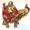 Buddha auriu pe elefant cu trompa ridicata